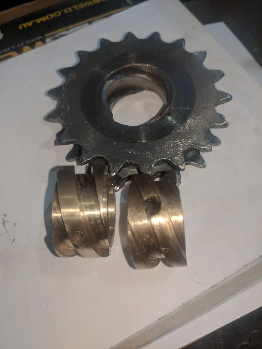 Bronze bushes machined to suit, with the sprocket they run in