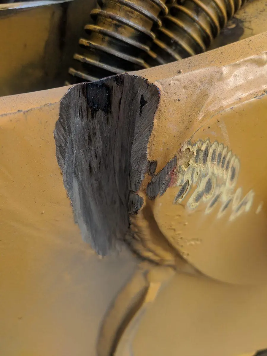 Worn gear teeth on a piece of plant, photographed on site