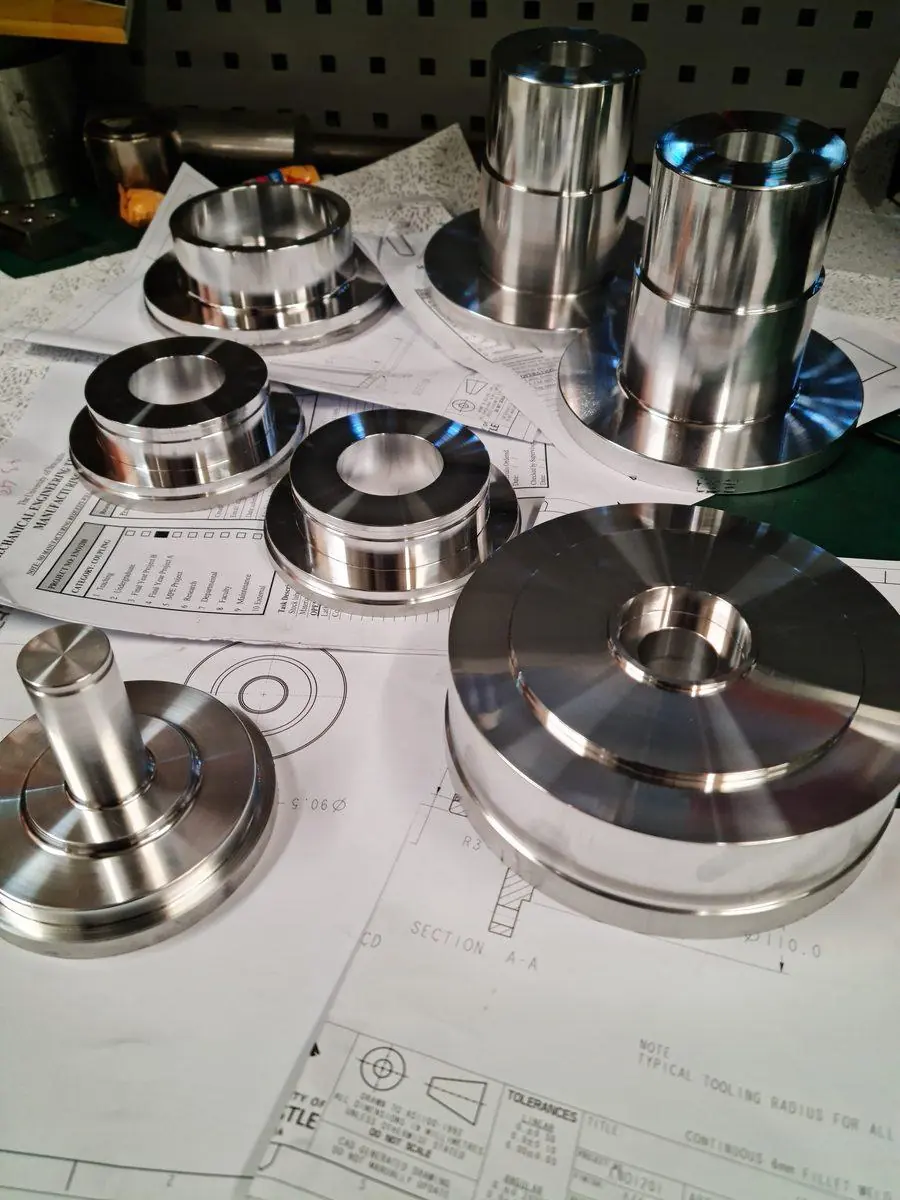 Finished turned components laid out on the production drawing