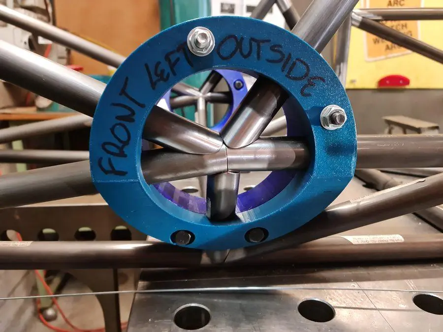 A blue anodised aluminium hub fitted into a stainless tube frame