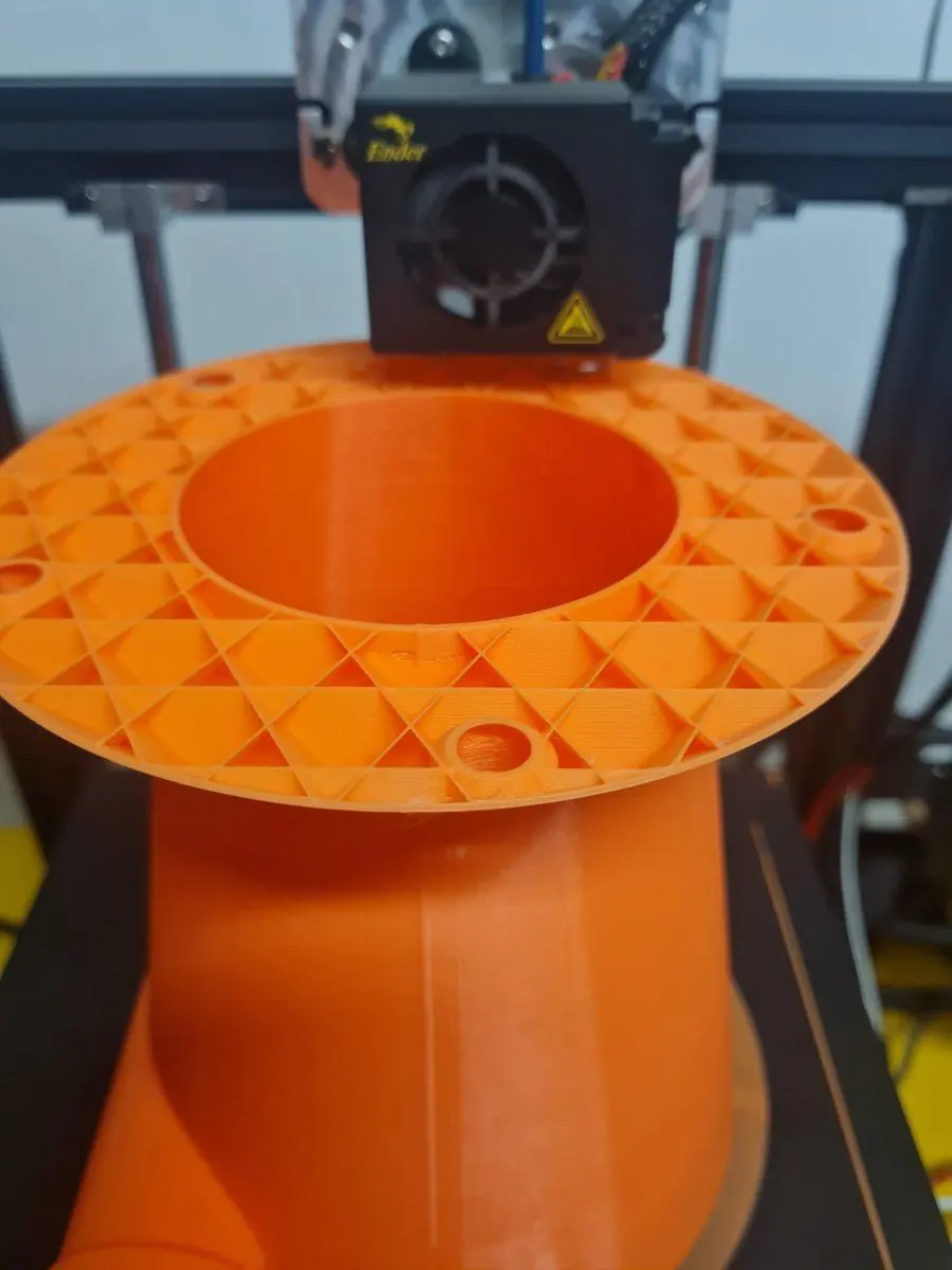 A 3D-printed prototype part on the printer before the metal version is machined