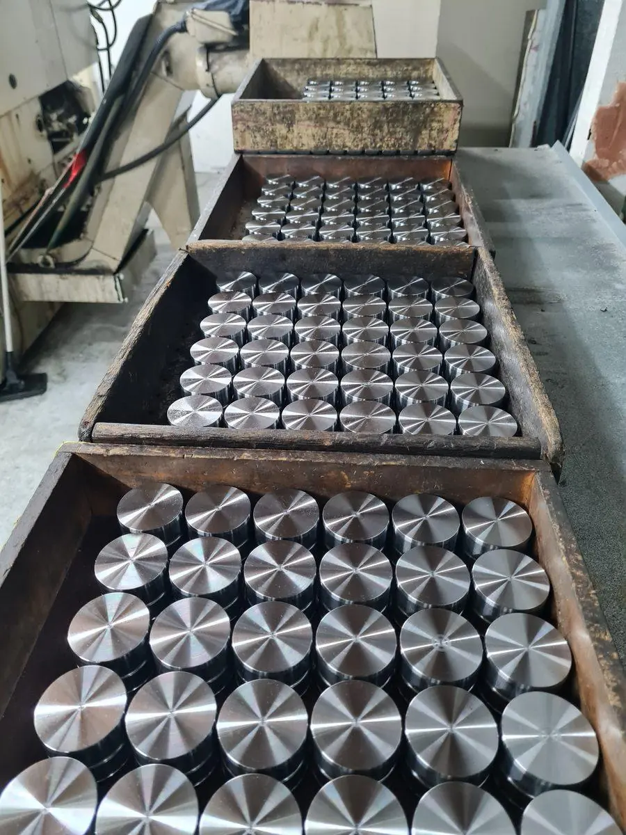 A full tray of finished turned components from a production run