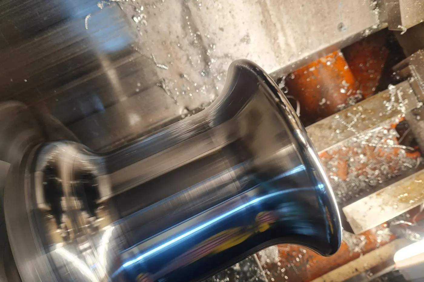 A stainless component being turned to a polished taper on the lathe at Port Stephens Machining