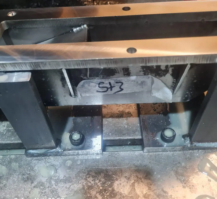 A welded assembly set up on the machine to be cut after welding